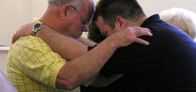 two people praying